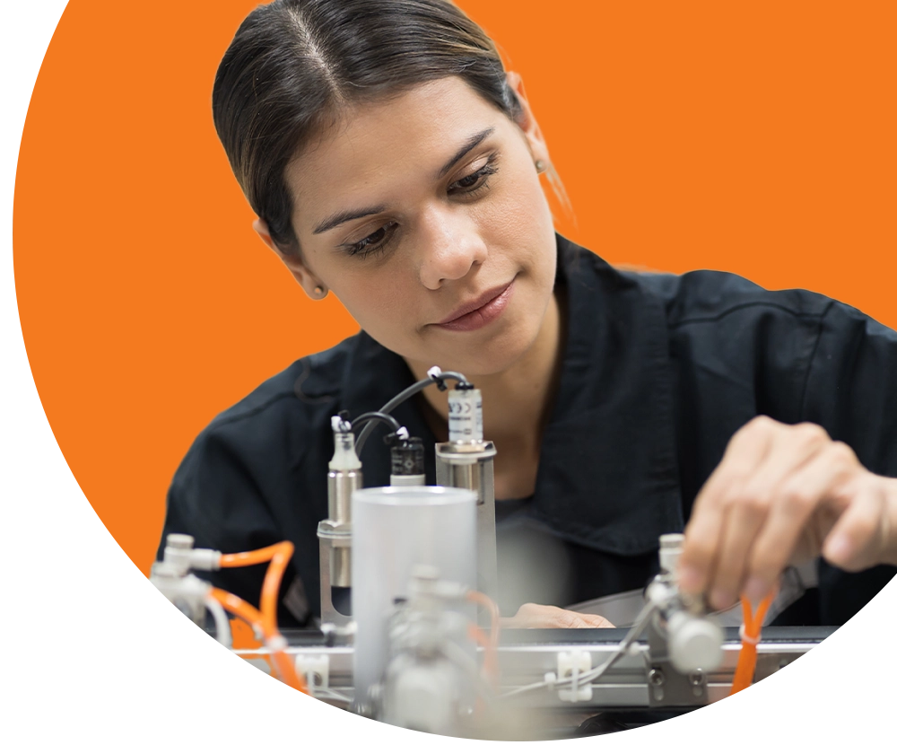 A woman working on an electrical component
