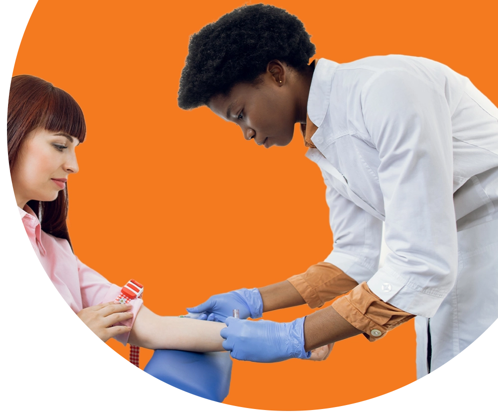 A medical professional prepares a patient for getting their blood drawn.